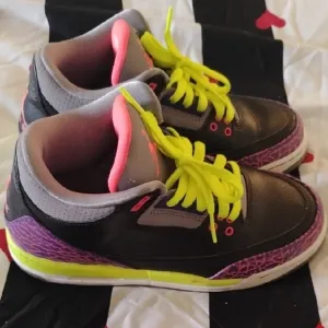 Vibrant Black and Purple Sneakers with Neon Accents
